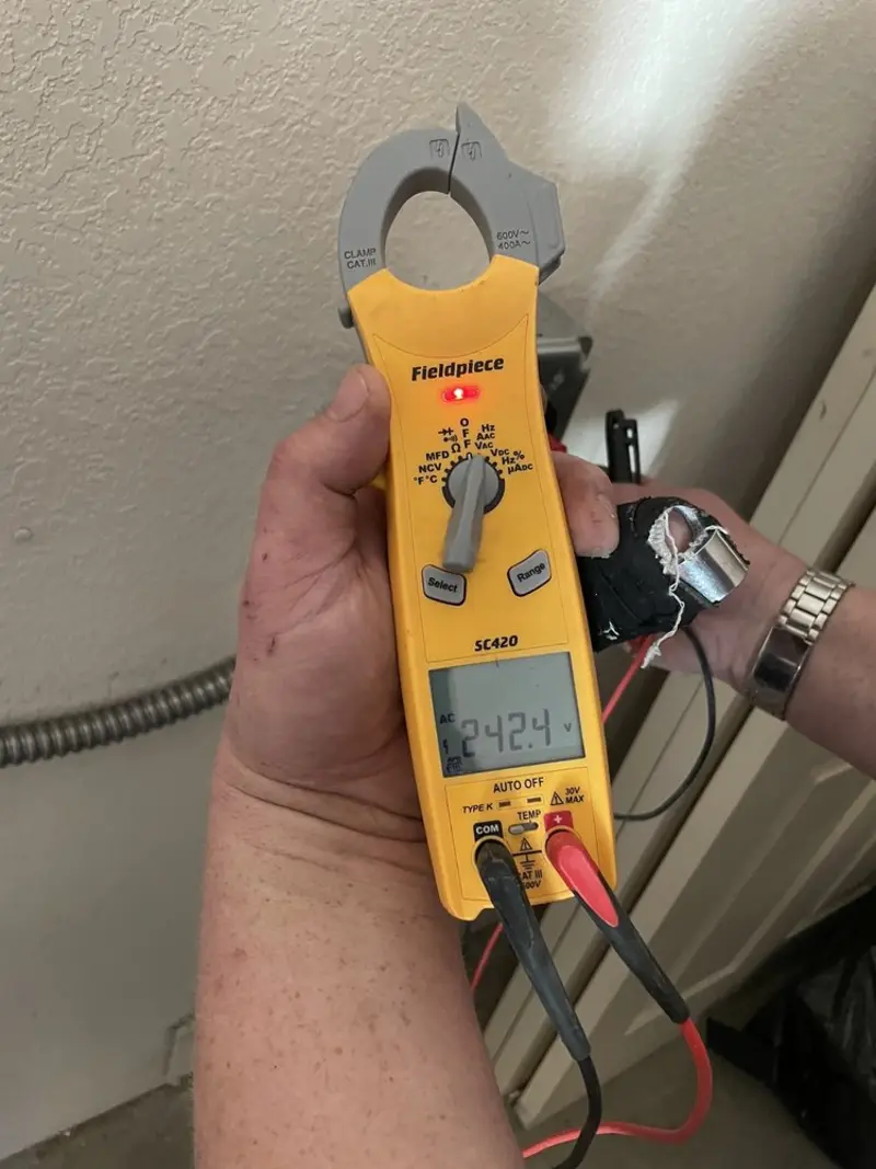 Voltage testing with clamp meter during Generator Installation in Port Sheldon